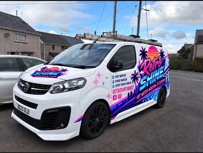 Retro Shine Window Cleaning branded white van with pink and blue graphics
